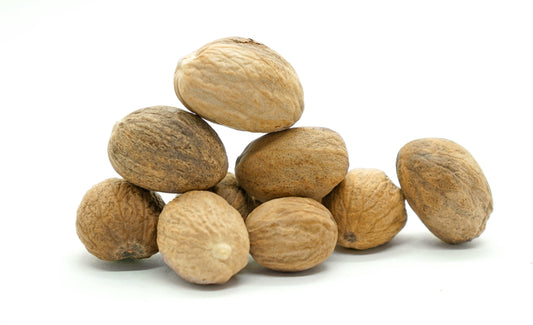 a pile of nutmeg on a white background